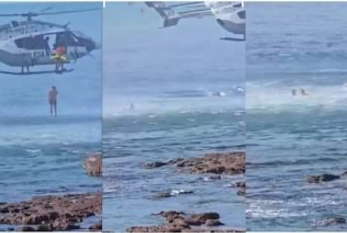 Homem tenta fugir nadando pelo mar e é capturado por helicóptero da polícia